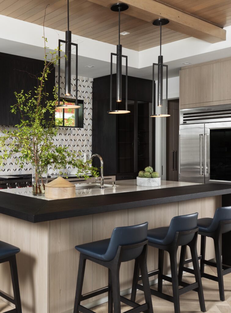 Modern coastal interior design of a kitchen with modern pendant lighting in kitchen.