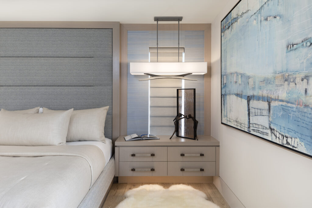 Master bedroom interior design with custom bed and wall headboard, and floating nightstands